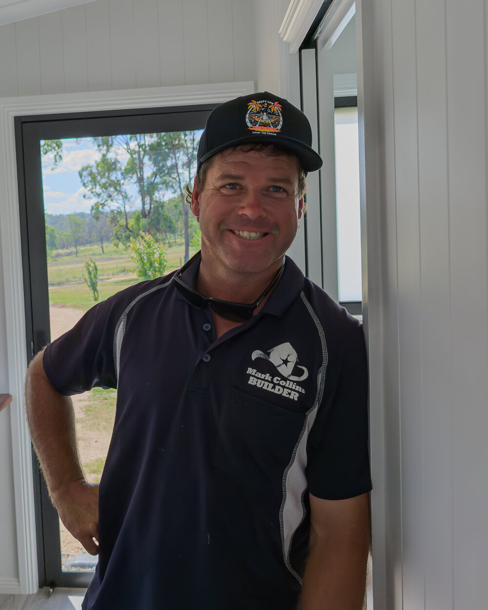 Mark Collins, licensed builder, on site at a finished build