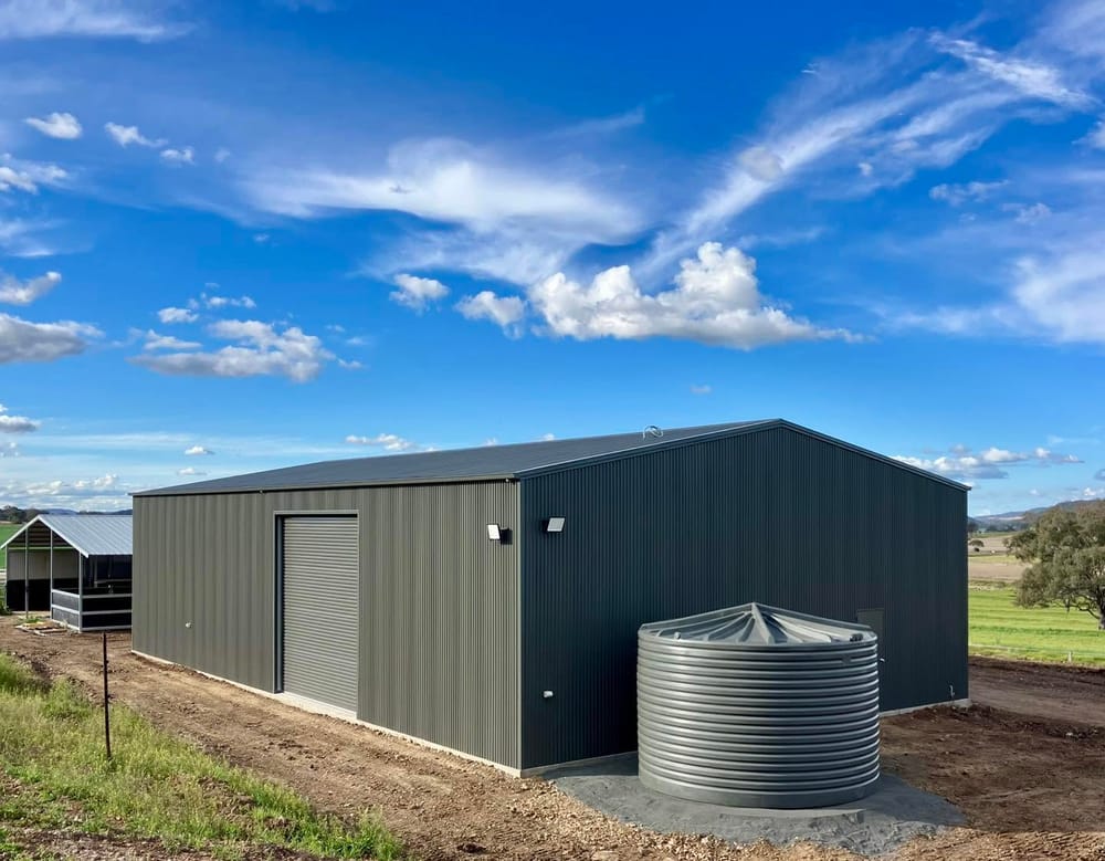 Colorbond machinery shed with rain tank on a Southern Downs property
